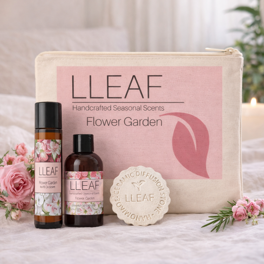 LLLEAF product set with bottles, pouch, and soap on a soft surface with flowers.