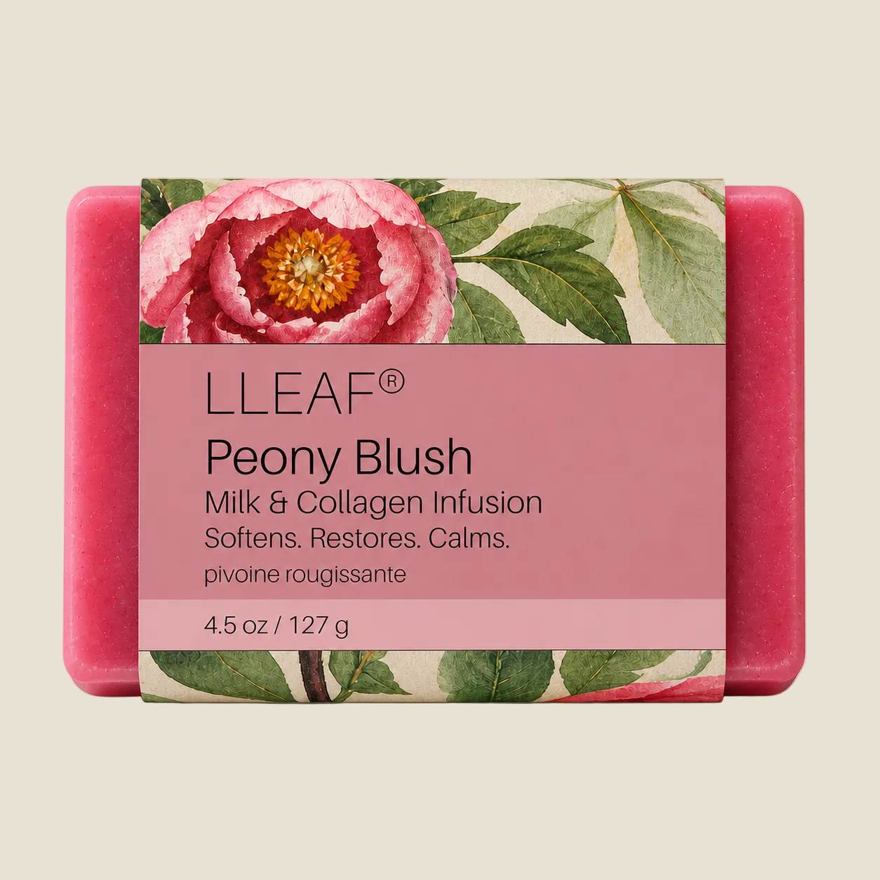A rectangular pink LLEAF Peony Blush soap bar with a floral paper label featuring a large pink peony and green leaves, shown on a light beige background.