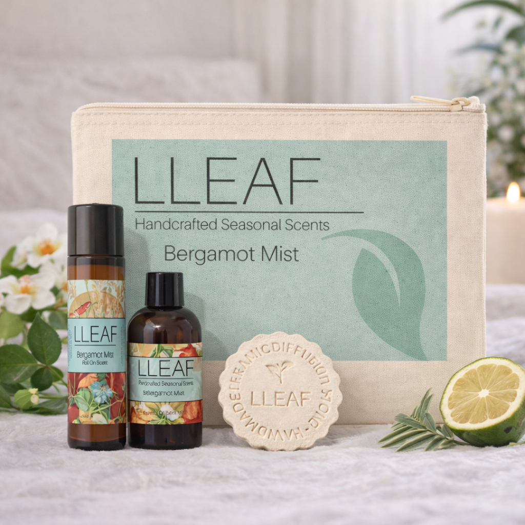 LLEAF product set including bottles, a pouch, soap, and a lemon wedge on a neutral background.