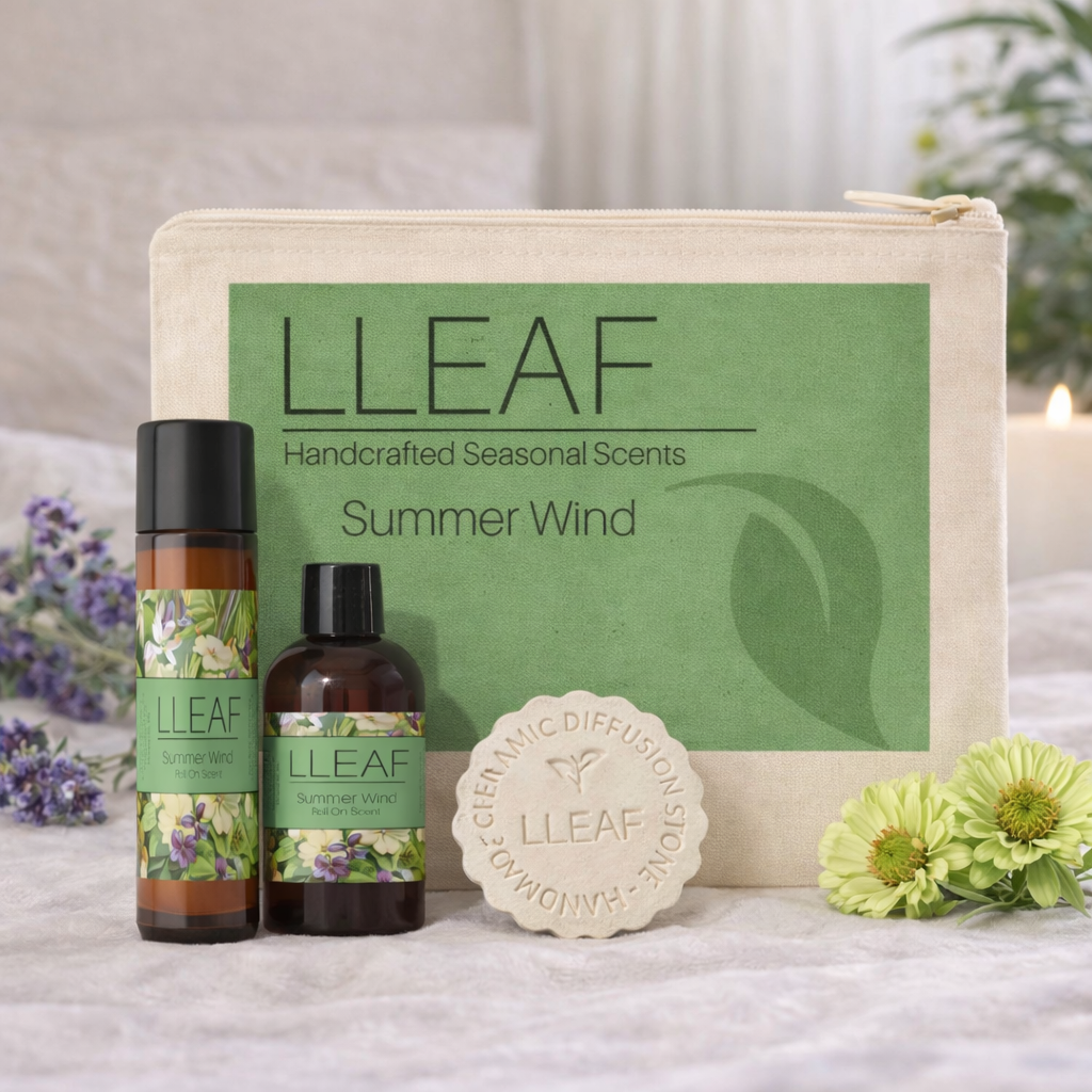 LLeaf handcrafted seasonal scents set with bottles, soap, and pouch on a soft surface with flowers.