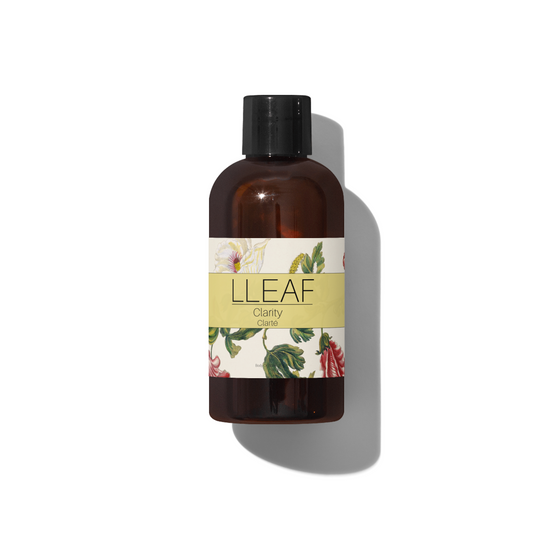 Bottle of LLEAF Clarity with a floral label on a white background